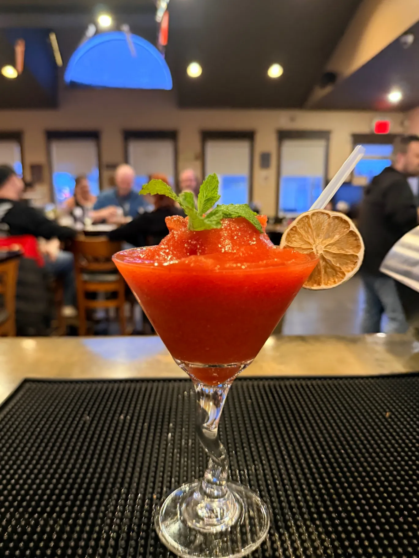 Cocktails lined up under the Nick's Lounge sign at the bar in Bonnyville, AB